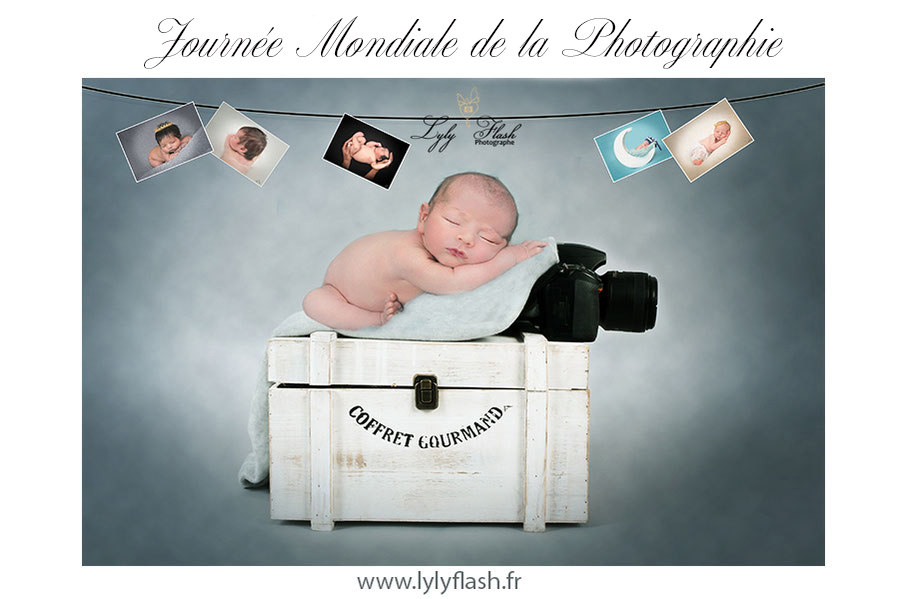 journée de la photographie. Bébé dort sur l'appareil photo nikon